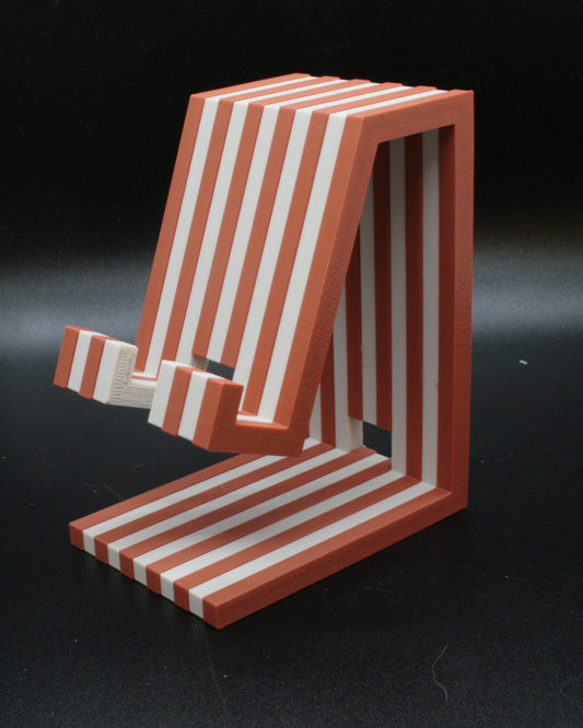 Red and white striped chair model on a black background